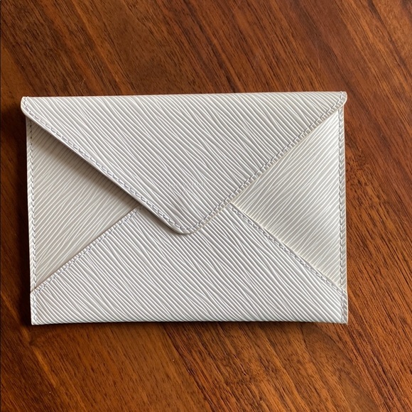 Louis Vuitton Accessories - Louis Vuitton - Textured Cream Clutch - authentic and rare